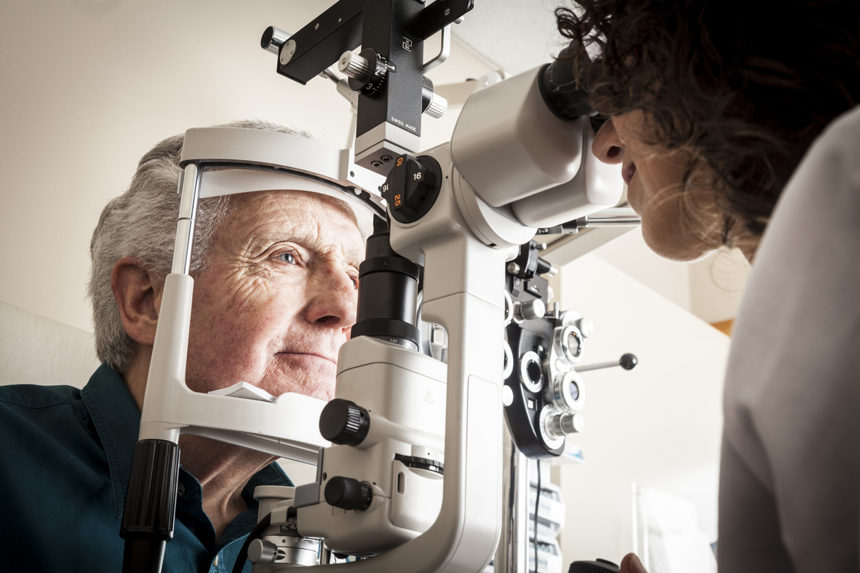 A senior man having an eye exam.