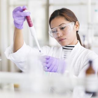 woman researcher in lab with pipette